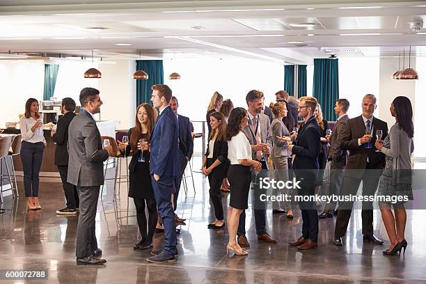 Delegates Networking At Conference Drinks Reception Stock Photo - Download Image Now