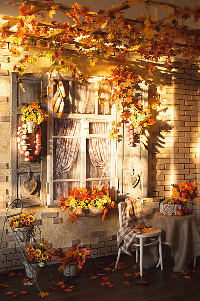 istock Evening patio. Window with vintage shutters decorated with autum 600073098