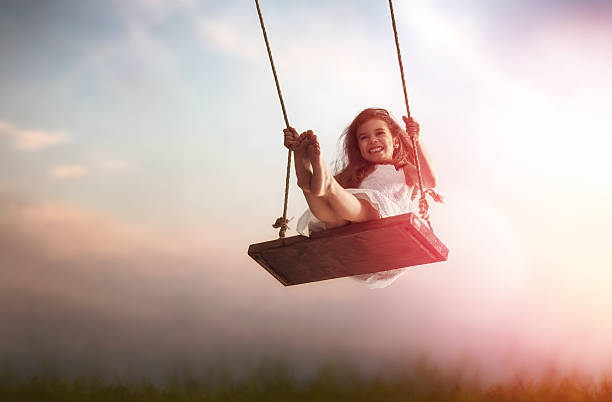 istock child girl on swing 600073504