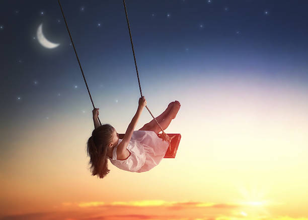 istock child girl on swing 600073704