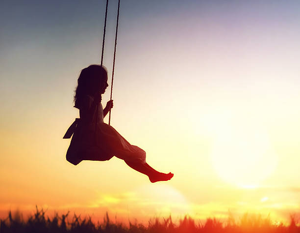 istock child girl on swing 600073848