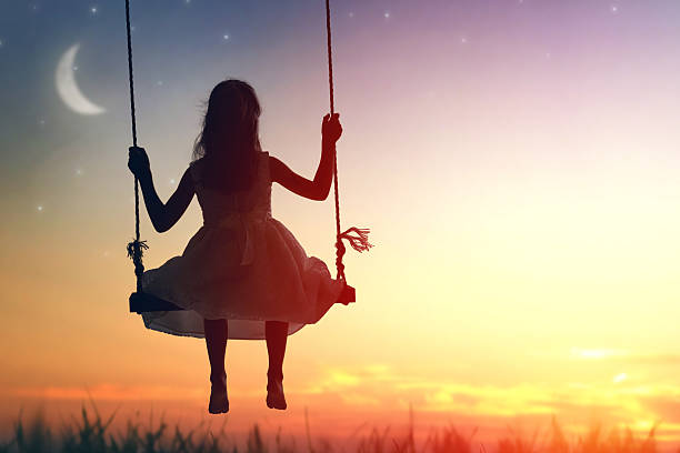 istock child girl on swing 600073926