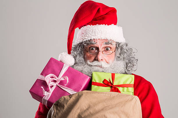 istock cheerful funny traditional santa claus 600073956