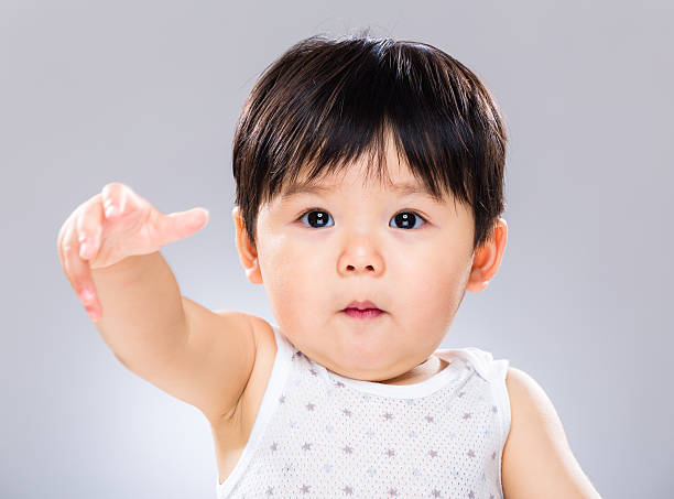 istock Chinese toddler reaching out 600081698