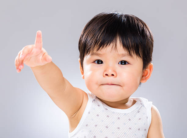 istock Chinese toddler reaching out 600081744