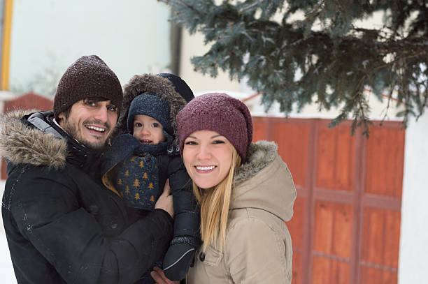 istock Happy family is having fun on the snow 600081986