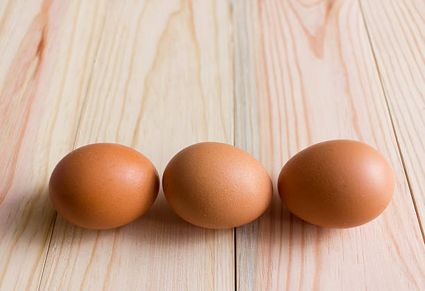istock Eggs on the wooden background, cooking concept 600083444
