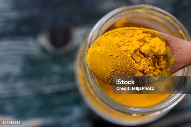 Turmeric Powder Stock Photo - Download Image Now - Turmeric, Spoon, Jar