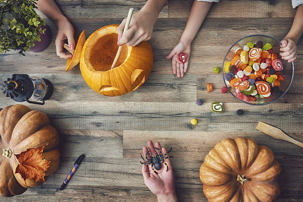 istock family preparing for Halloween. 600084980