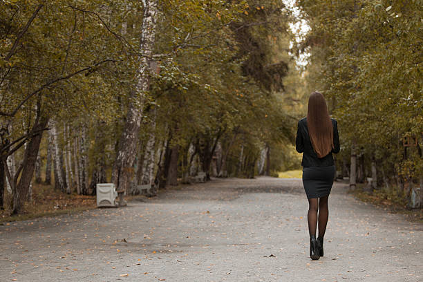 istock Young girl walking in autumn park 600086558
