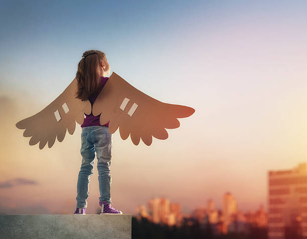 istock Kid with the wings of a bird 600088046