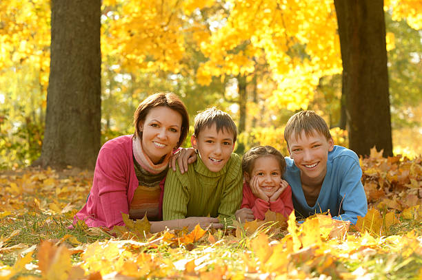 istock Family relaxing in autumn park 600088306