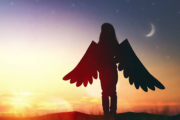 istock Kid with the wings of a bird 600088456