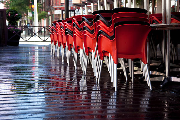 istock Chairs and Tables Piled on an Outdoor Patio 600089128
