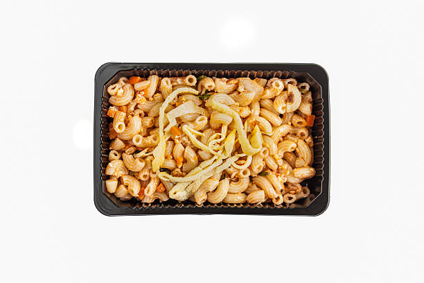 istock stir in the macaroni and tomato sauce 600089400