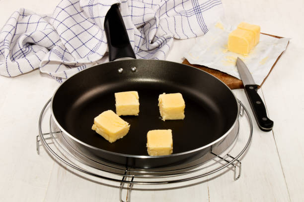 istock diced butter in a frying pan 600089930