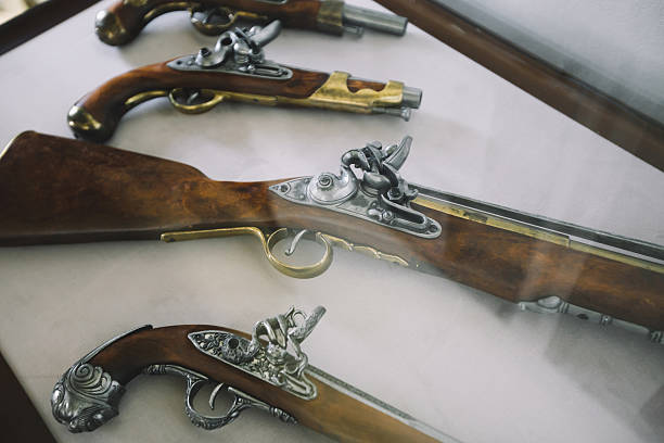 istock Old vintage wooden guns on a showercase 600090526