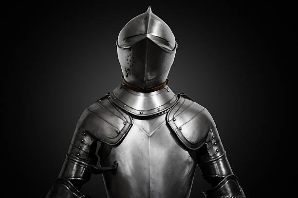 istock Old metal knight armour on black background 600091078