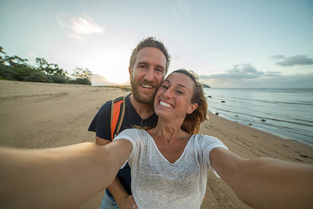 istock Beautiful young couple take selfie portrait on beach 600091380