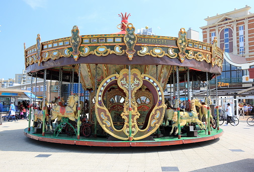Liverpool Royal Albert Dock Victorian Carousel and Pump House in England UK United Kingdom. The Dock's former pumphouse built in 1870, has been restored to a public house