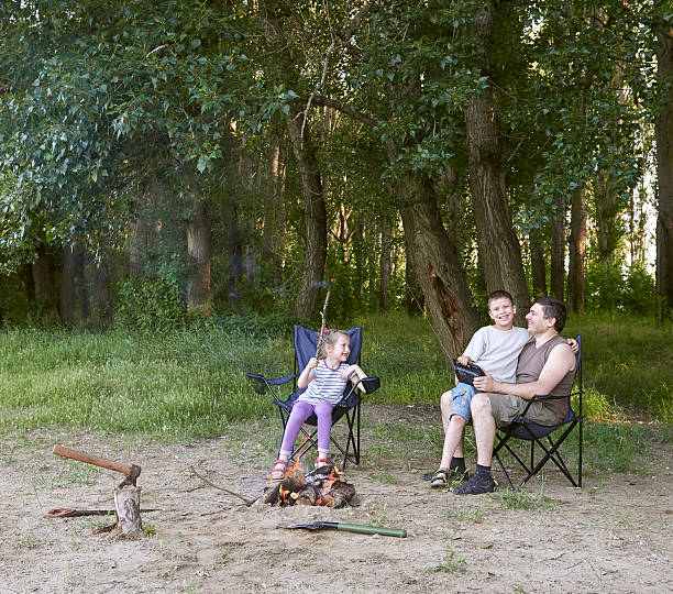 istock people camping in forest, family active in nature, kindle fire 600094832