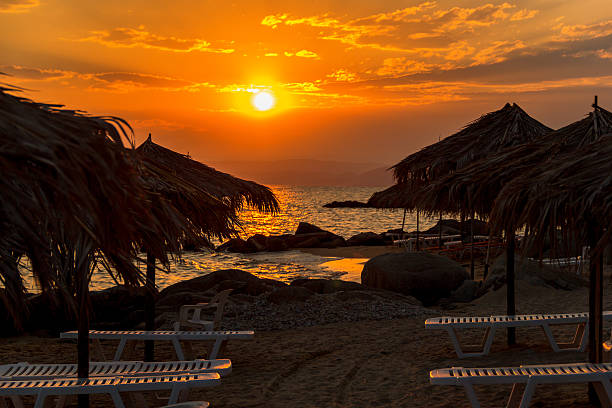 istock Sun loungers with an umbrella on the beach 600097038