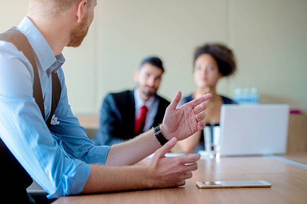 istock Young business people having meeting 600097344