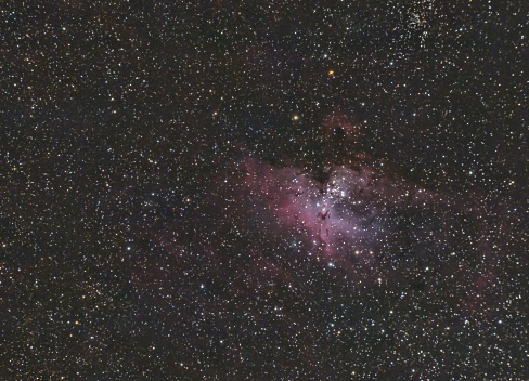 The Eagle Nebula, also known as Messier 16 or M16, consists of a star cluster and many emission nebulae and dark nebulae, in the direction of the constellation the Serpent. It’s the location of several famous structures including the Pillars of Creation. The Eagle Nebula was named for its shape, which resembles that of an eagle. It is part of a larger H II region designated as IC 4703, which is a diffuse emission nebula approximately 7,000 light years from Earth.