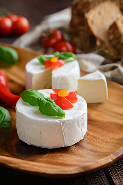 istock Camembert cheese with whole wheat bread and basil 600098608