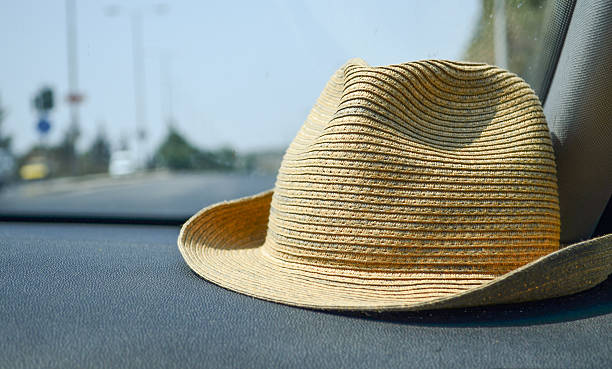 istock summer hat in the car. 600098684