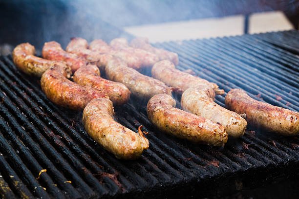 istock BBQ with fiery sausages on the grill 600100024