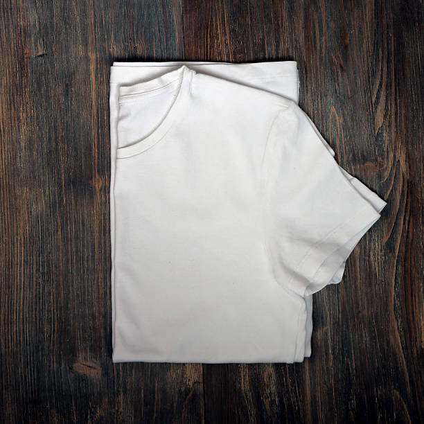 istock White T-shirt on wooden board. 600101512