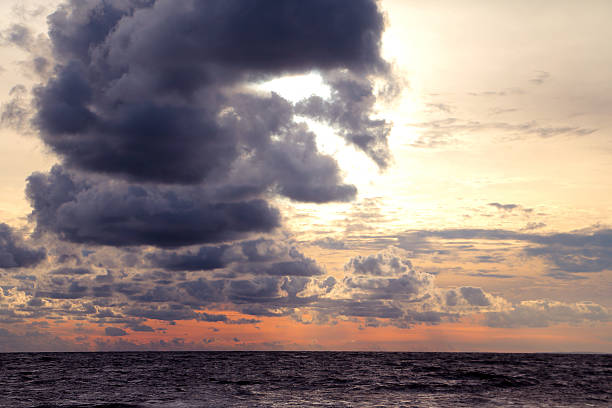 istock Beautiful scenic sunset at sea with dramatic clouds 600102410