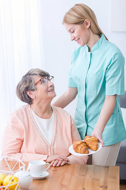 istock Senior woman and caregiver 600103106