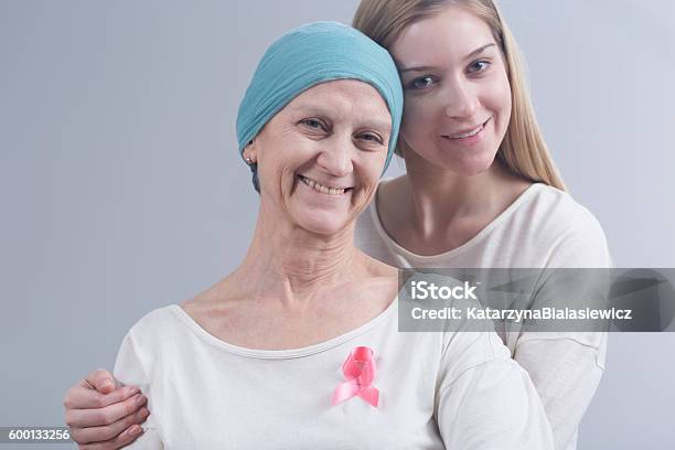 Staying Together In Tough Disease Stock Photo - Download Image Now - Adult, Assistance, Breast Cancer Awareness