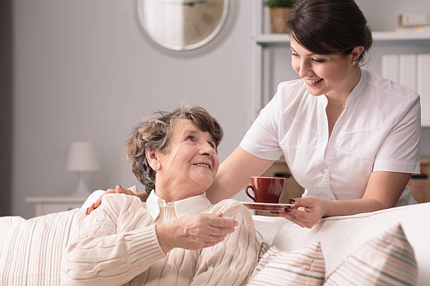 istock Caregiver serving the tea 600133360