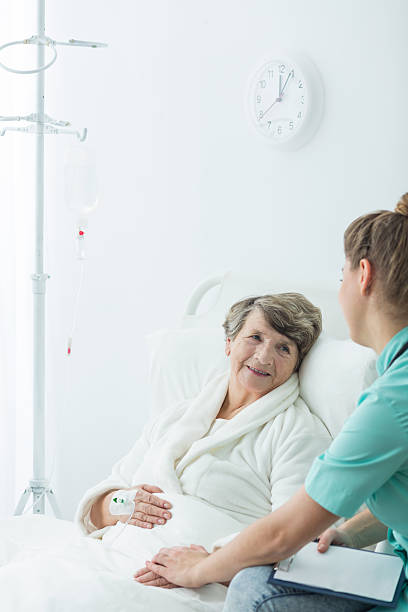 istock Rest home resident and carer 600133594