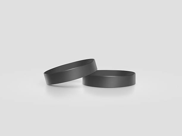 Blank black rubber wristband mockup, clipping path, mock up design Blank black rubber wristband mockup, clipping path, 3d illustration. Clear sweat band stack mock up design. Sport sweatband pile template. Silicone fashion round social bracelet. Unity band. bracelet photos stock pictures, royalty-free photos & images