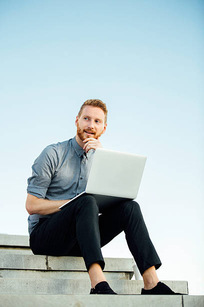 istock Young businessman working outdoor 600135566