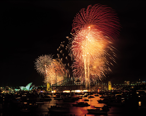 Fireworks over Sydney harbour Bridge and Opera House.