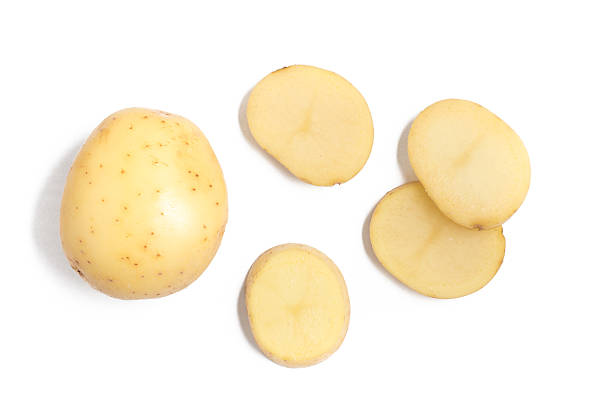 Raw Potato Sliced Raw Potato Sliced isolated in white background prepared potato stock pictures, royalty-free photos & images