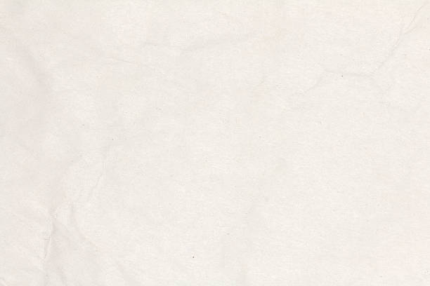 istock Recycled crumpled light brown paper texture or paper background. 600138582