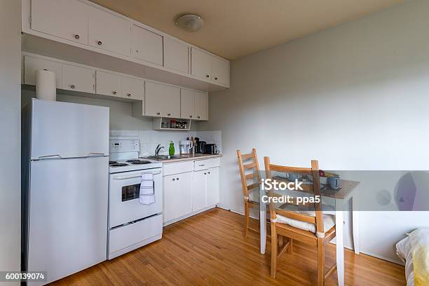 Cozy Kitchen With A Small Dinner Table Interior Design Stock Photo - Download Image Now