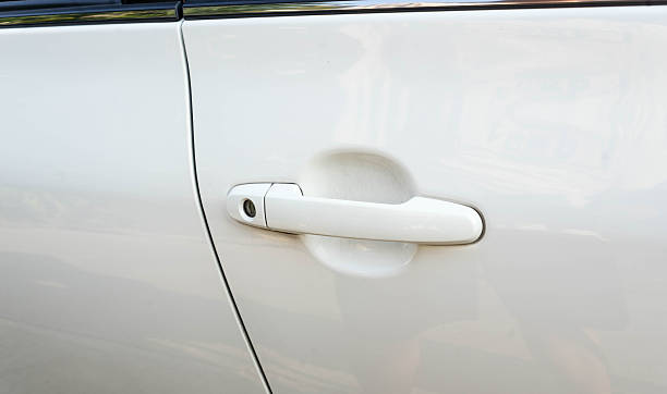 istock white car door and white handle focus for background 600145466