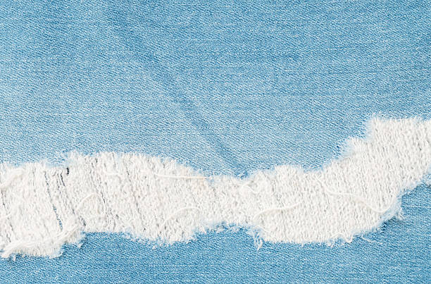istock Closeup surface of old jean trousers fabric texture background 600146432