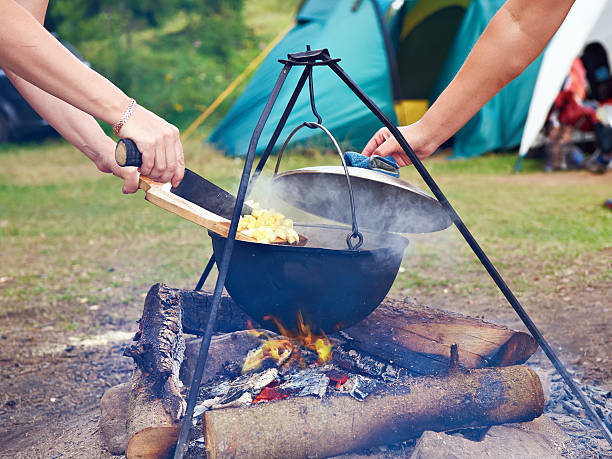 istock Cooking food over campfire in hike 600149186