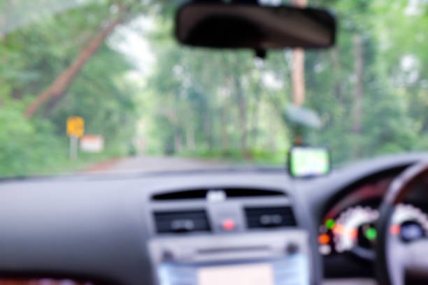 istock blur of view from inside of a car 600151738
