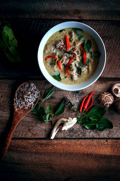 istock Thai Green Curry With Chicken Recipes on wooden background 600151906