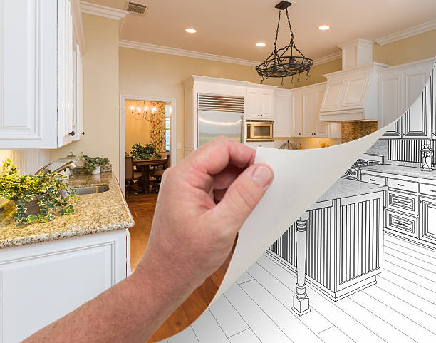 istock Hand Turning Page of Custom Kitchen Photograph to Drawing 600152030