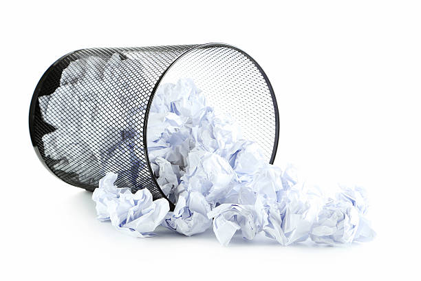 istock Office trashcan with crumpled paper balls isolated on white 600154748